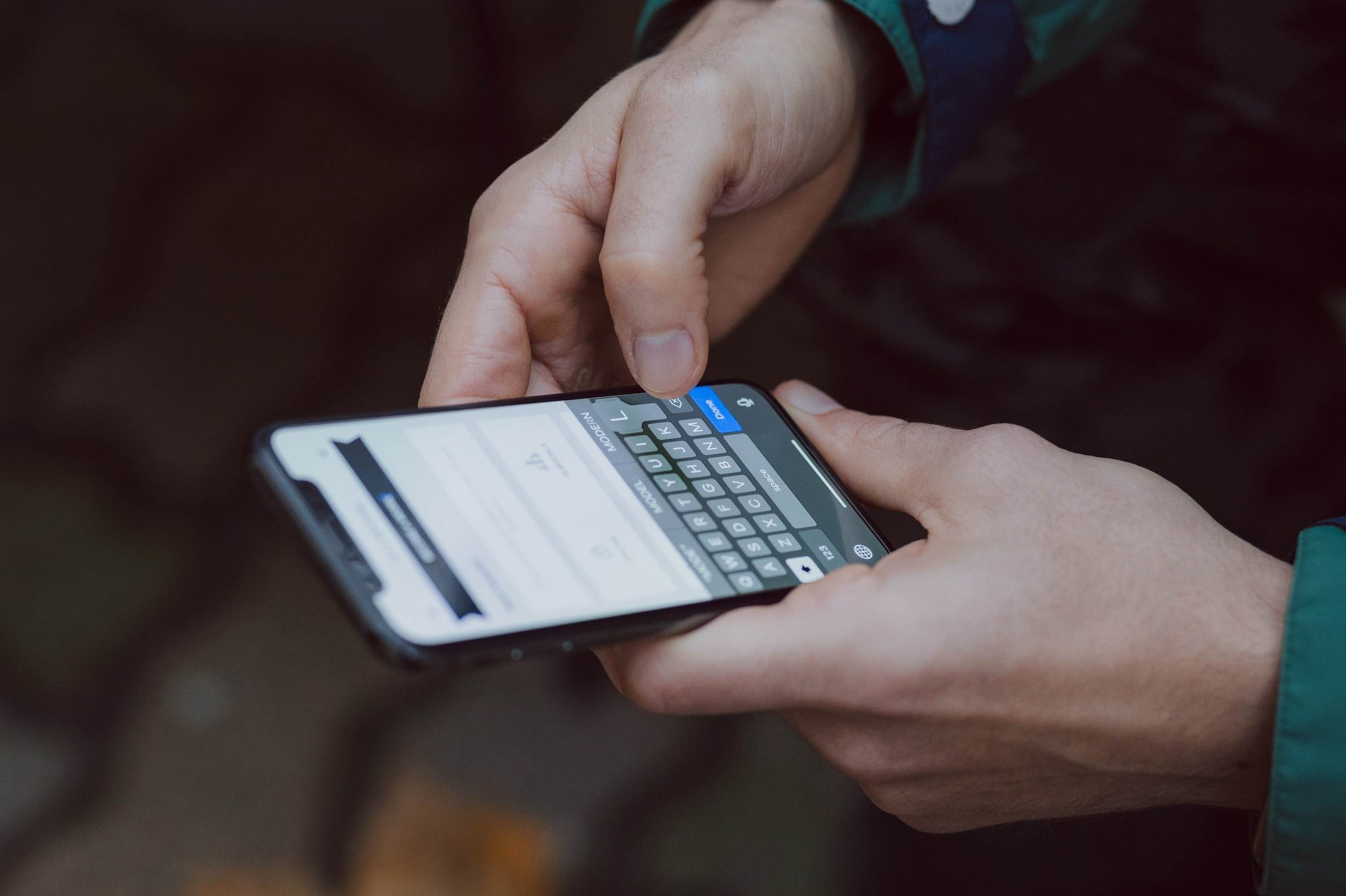 image of a person holding a mobile phone