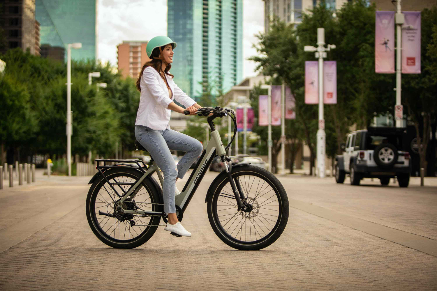 Woman riding a Denago Commute Model 1 eBike in Dallas