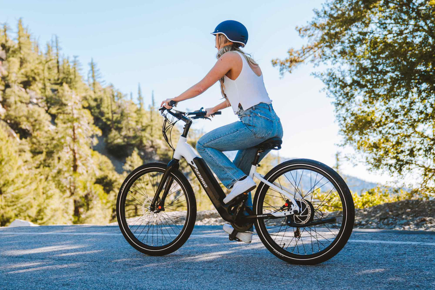 Woman in a white shirt with an eBike on Mt. Baldy road