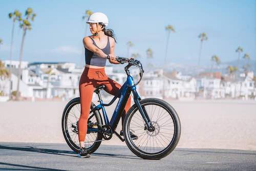 woman on beach bike path with Denago City Model 2 eBike