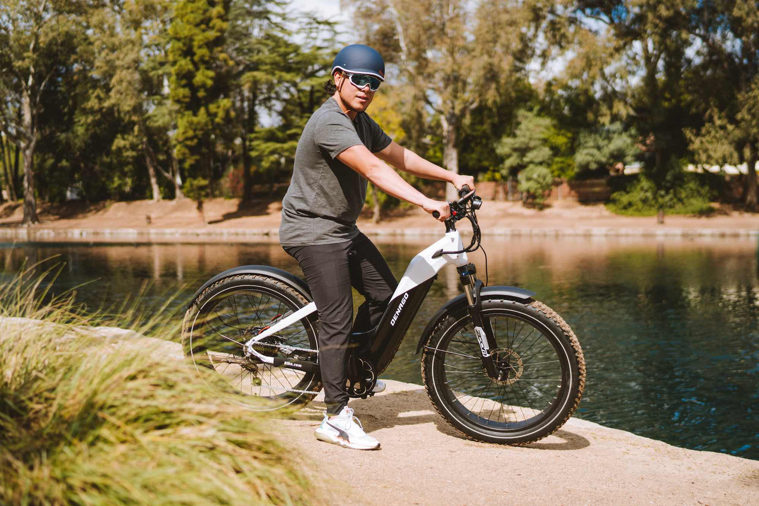 Denago fat tire eBike parked next to a lake.